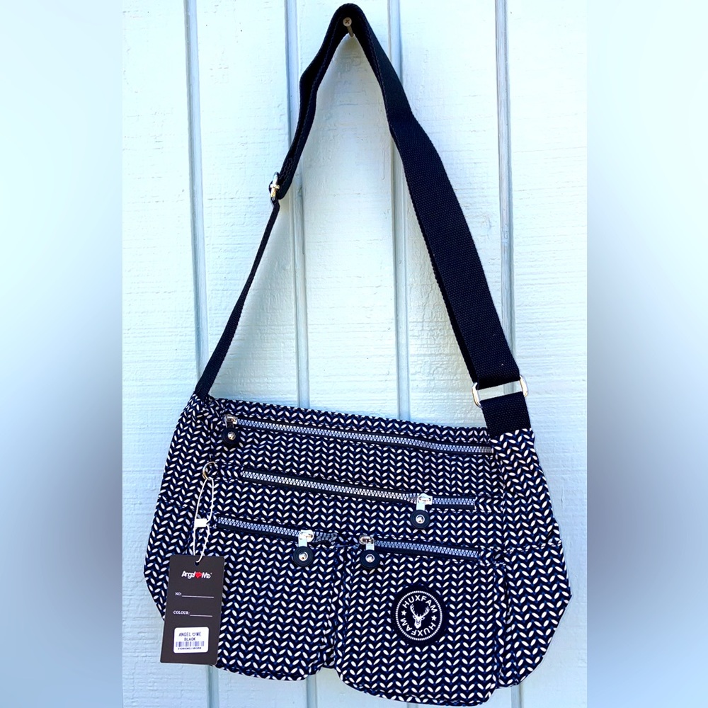 Crossbody shoulder bag with multiple pockets and zipper closure